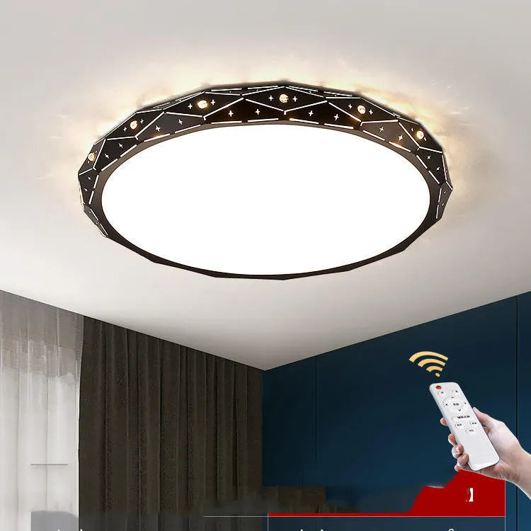 Round black iron frame LED ceiling light on a white ceiling.