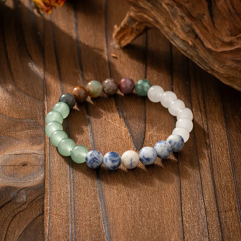 Bohemian style long necklace with natural stone beads and matching bracelet on a jumper