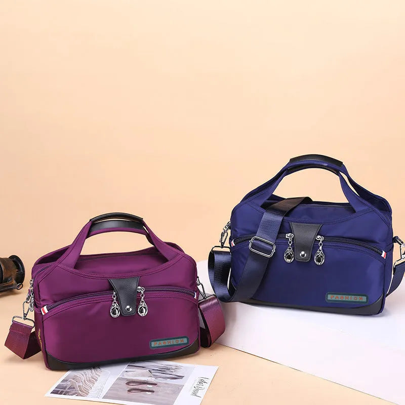 Women's anti-theft crossbody shoulder bag in Oxford cloth with multiple pockets and adjustable strap