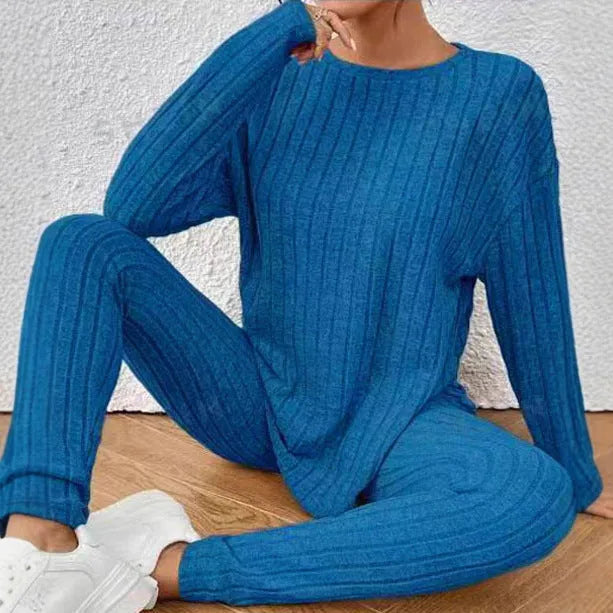 Black sunken stripe pattern two-piece loungewear set with regular sleeves on a hanger.