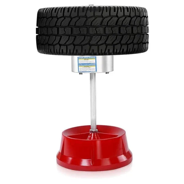 Portable hub balancer with aluminium head and enamel-finished base for balancing car and truck tyres.