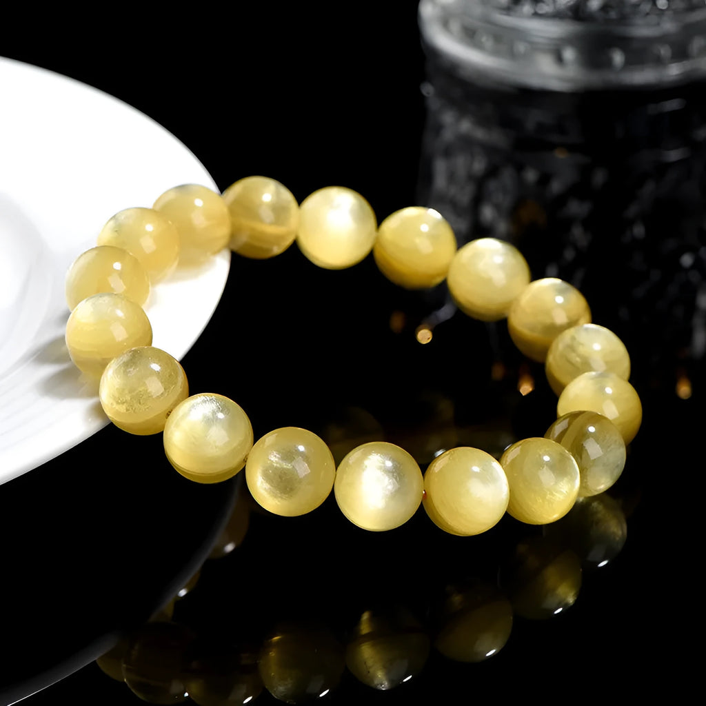 Yellow lepidolite mica bracelet with golden dragon design on round beads