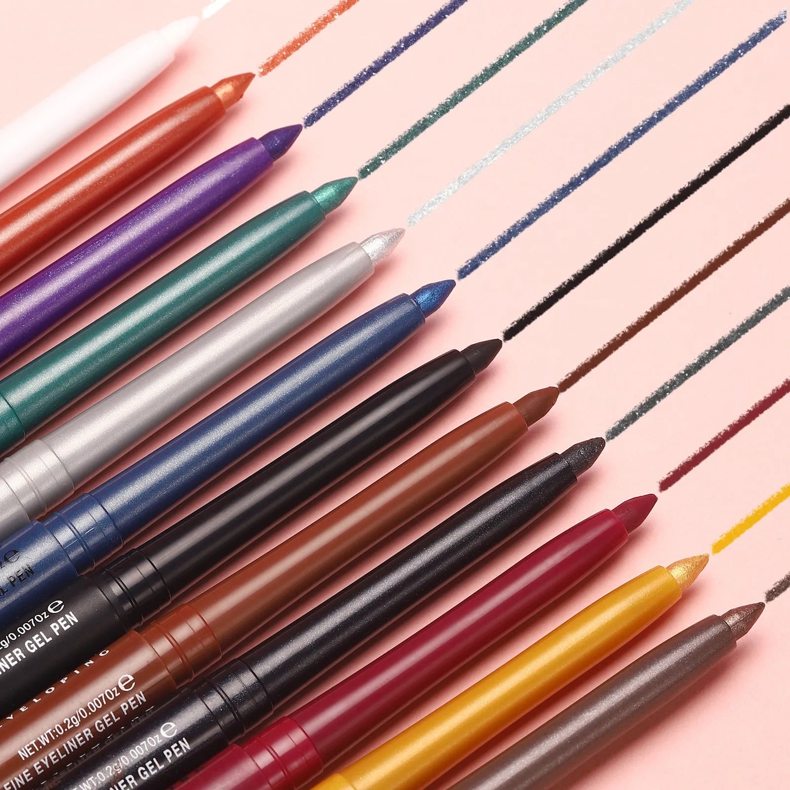 Set of 12 colourful gel glitter eyeliner pencils with vibrant shades on a white background
