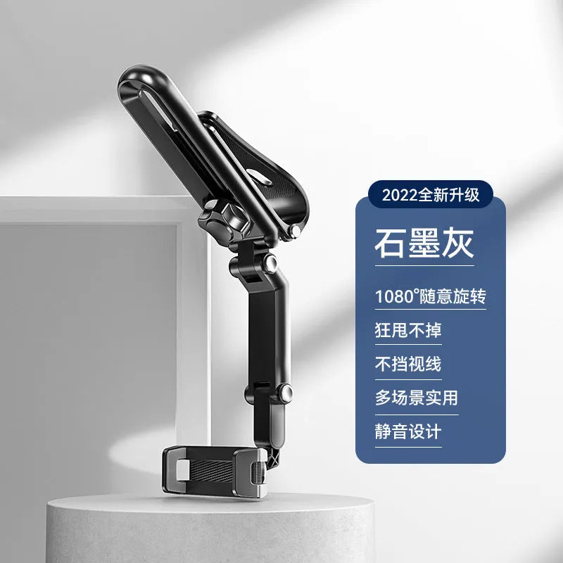A black and grey car phone holder bracket clipped onto a vehicle air vent.