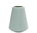A simple white melamine plastic decorative flower vase on a wooden tabletop.