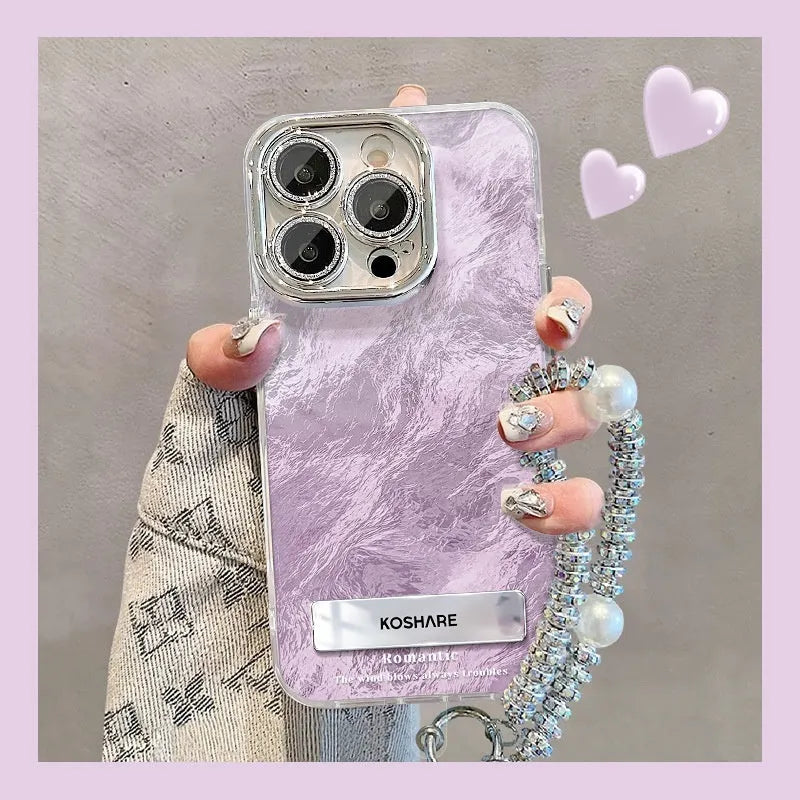 Ice blue gradient hard PC phone case with invisible bracket and silver chain for iPhone set on a white surface