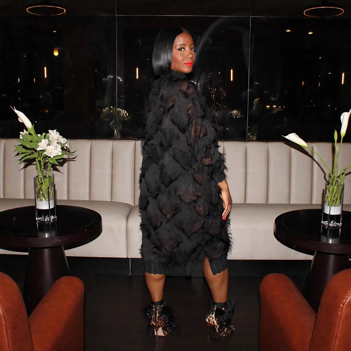 Black chiffon fringe loose mid-length dress with stand collar and long sleeves on a model