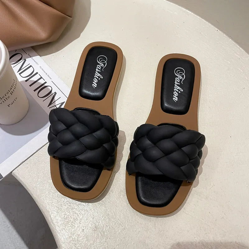 Women's PVC beach sandals with a thick non-slip sole in black, shown on a white background.