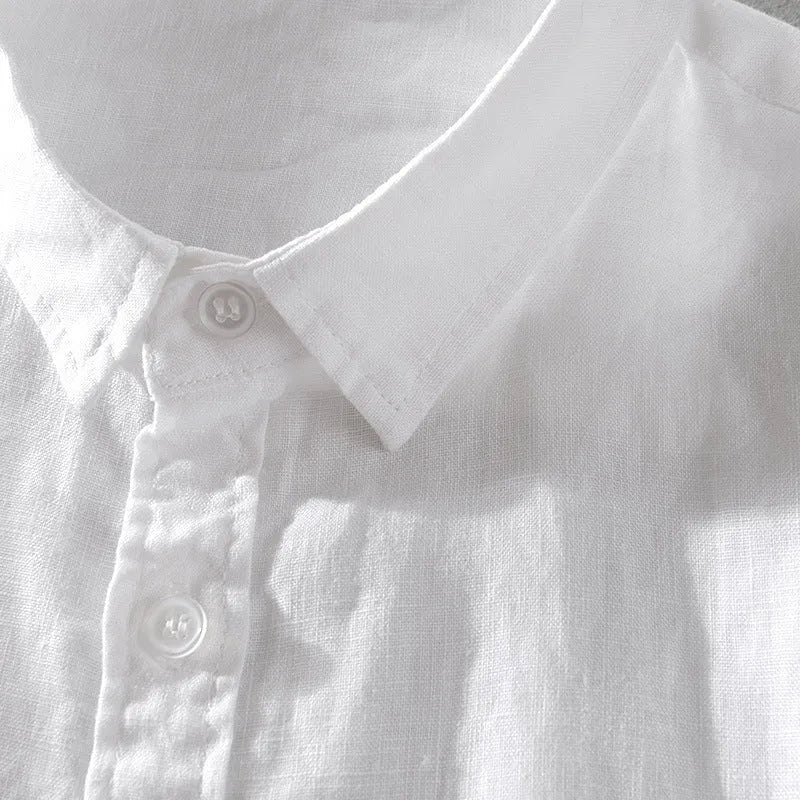 Man wearing a short sleeve apricot coloured loose-fit linen blend casual shirt.