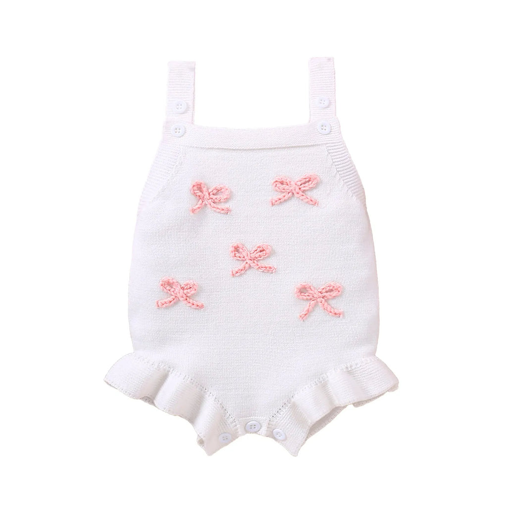 Baby sling-style wool blend romper with bow embroidery, in white or pink, sizes 0-3M to 12-18M