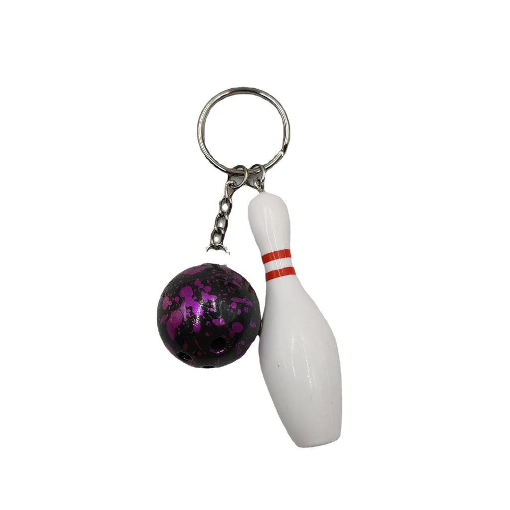 Mini simulation bowling ball keychain pendant in dark red, blue, purple, and green colour options.