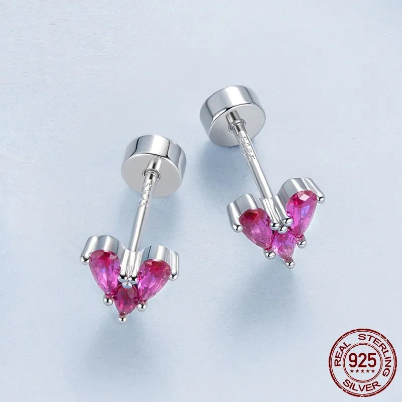 Rose red heart shaped 925 silver small ear studs for women on white background