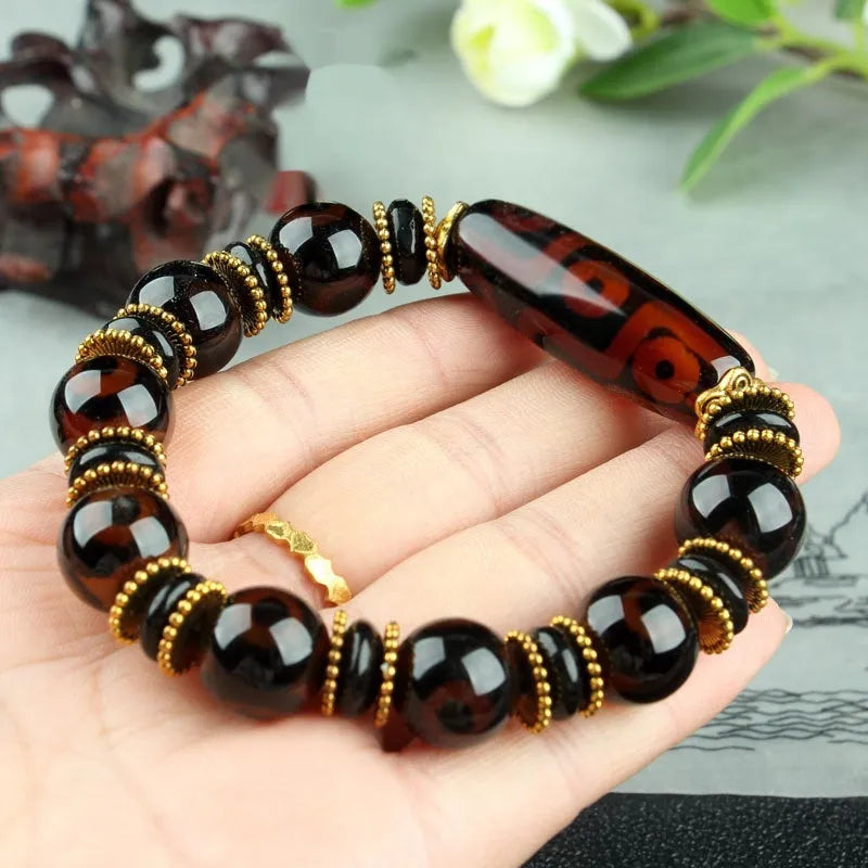 Distressed agate Tibet beads bracelet with three eye dzi design and polished stone beads