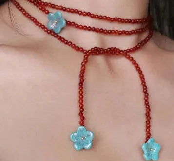 Red agate and acrylic geometric beaded necklace on a woman, adjustable chain 31-40cm