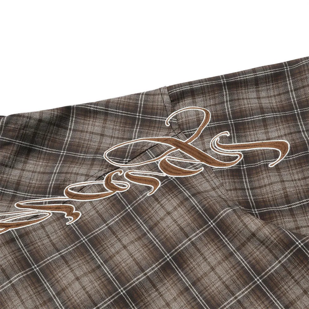 Men's black and brown plaid shirt with embroidered letter detail on chest, short sleeves, lapel collar