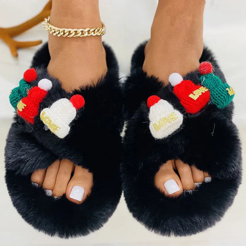 Women's Christmas hat slippers in faux plush with cotton lining and rubber sole.