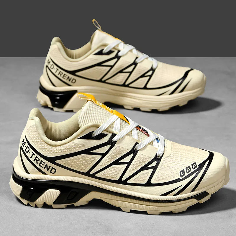 Low-top outdoor hiking shoes in artificial leather with mesh lining and rubber sole.