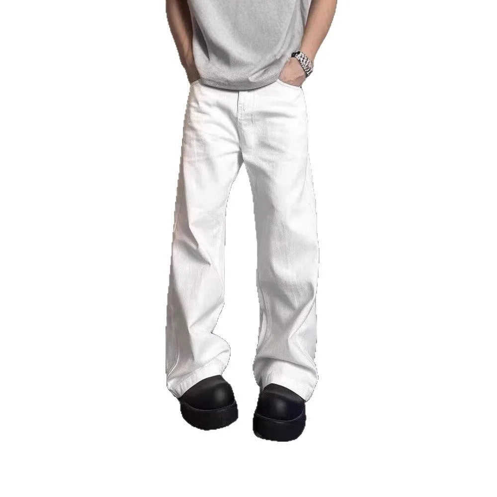 Men's loose straight leg white cotton denim jeans on a hanger.