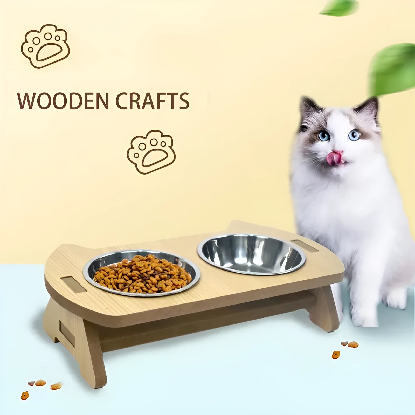 Wooden cat feeder with two stainless steel bowls for food and water on an anti-tip base.