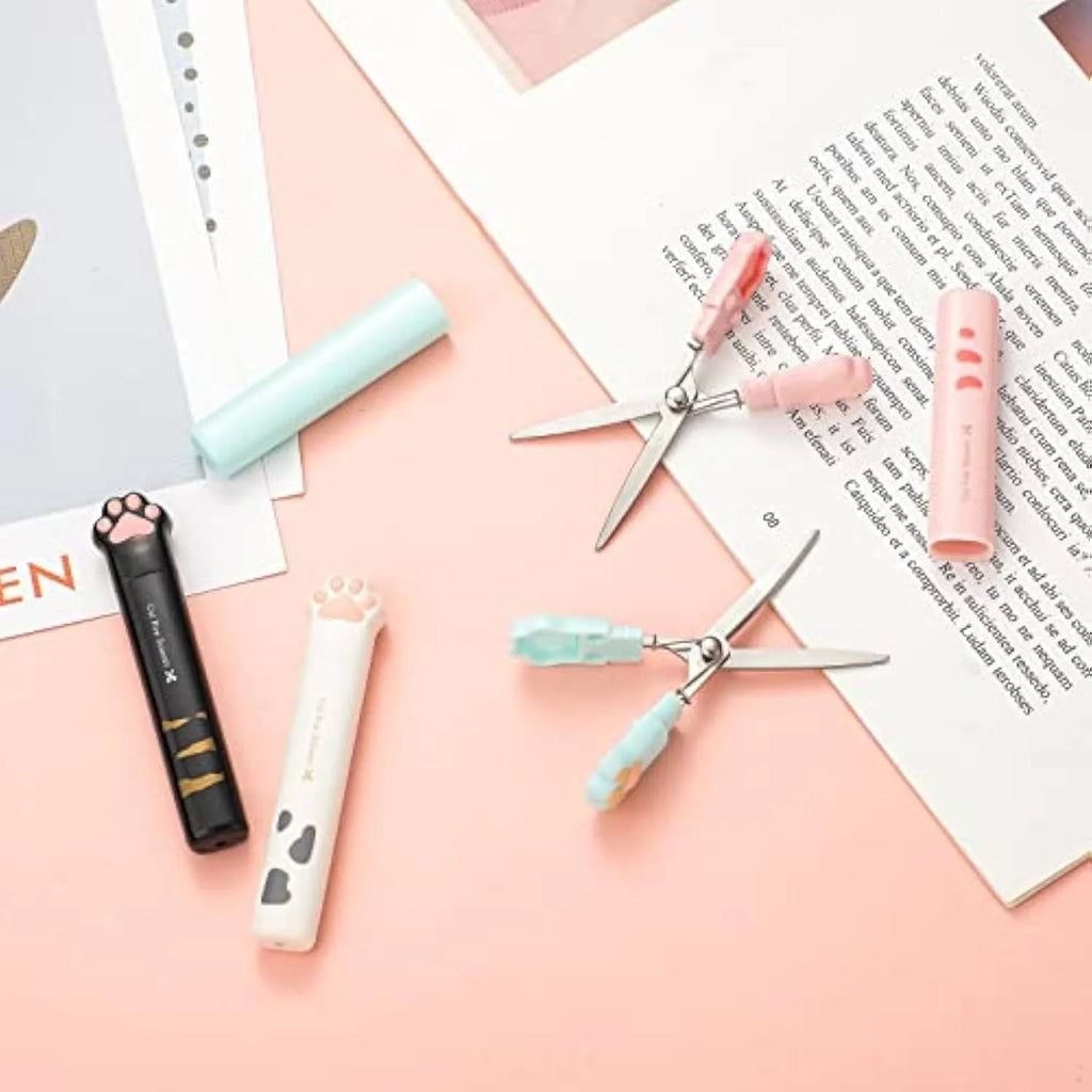 Cat paw design mini folding scissors with stainless steel blades shown open and closed
