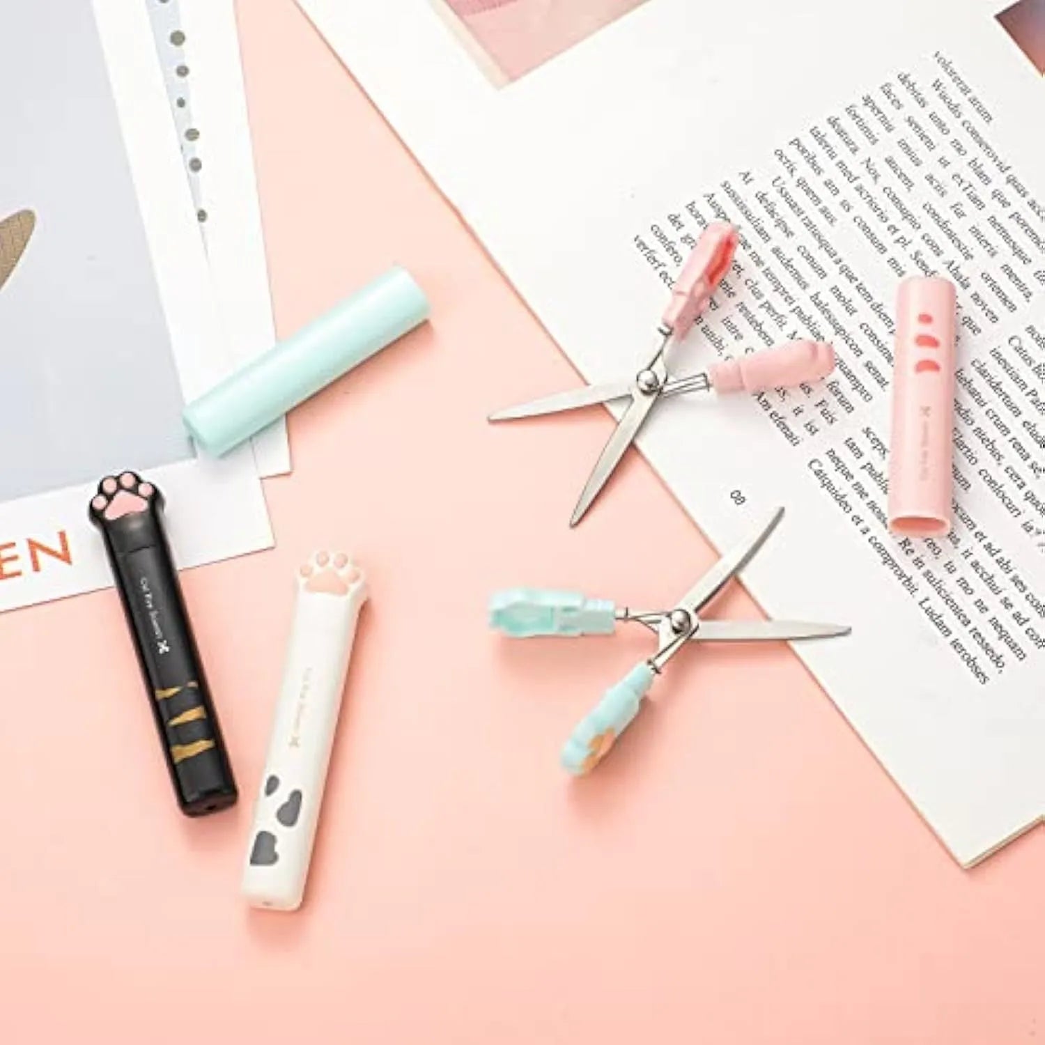 Cat paw design mini folding scissors with stainless steel blades shown open and closed