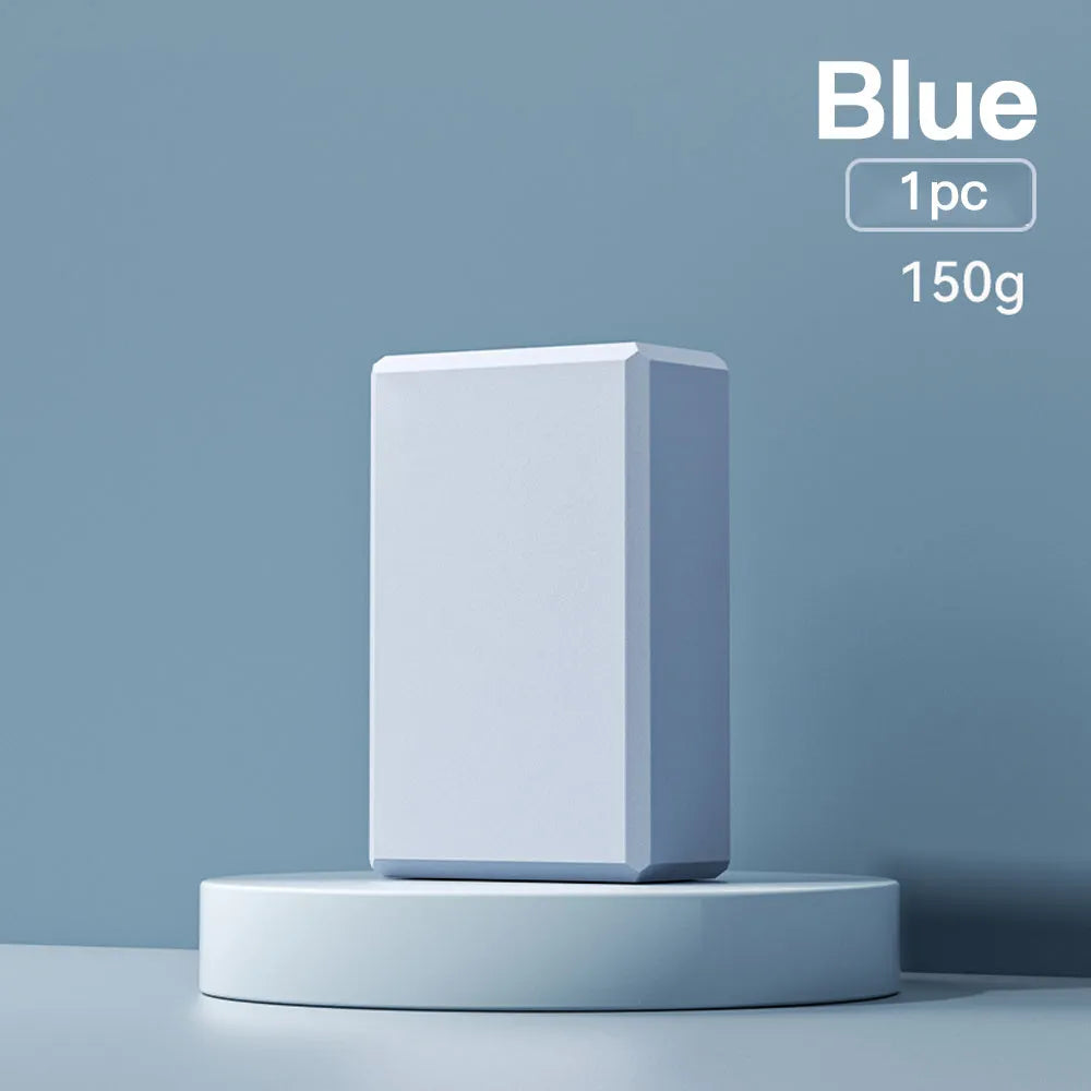 Solid colour EVA foam yoga block with hexagonal ridges, shown next to tape measure showing 23cm length