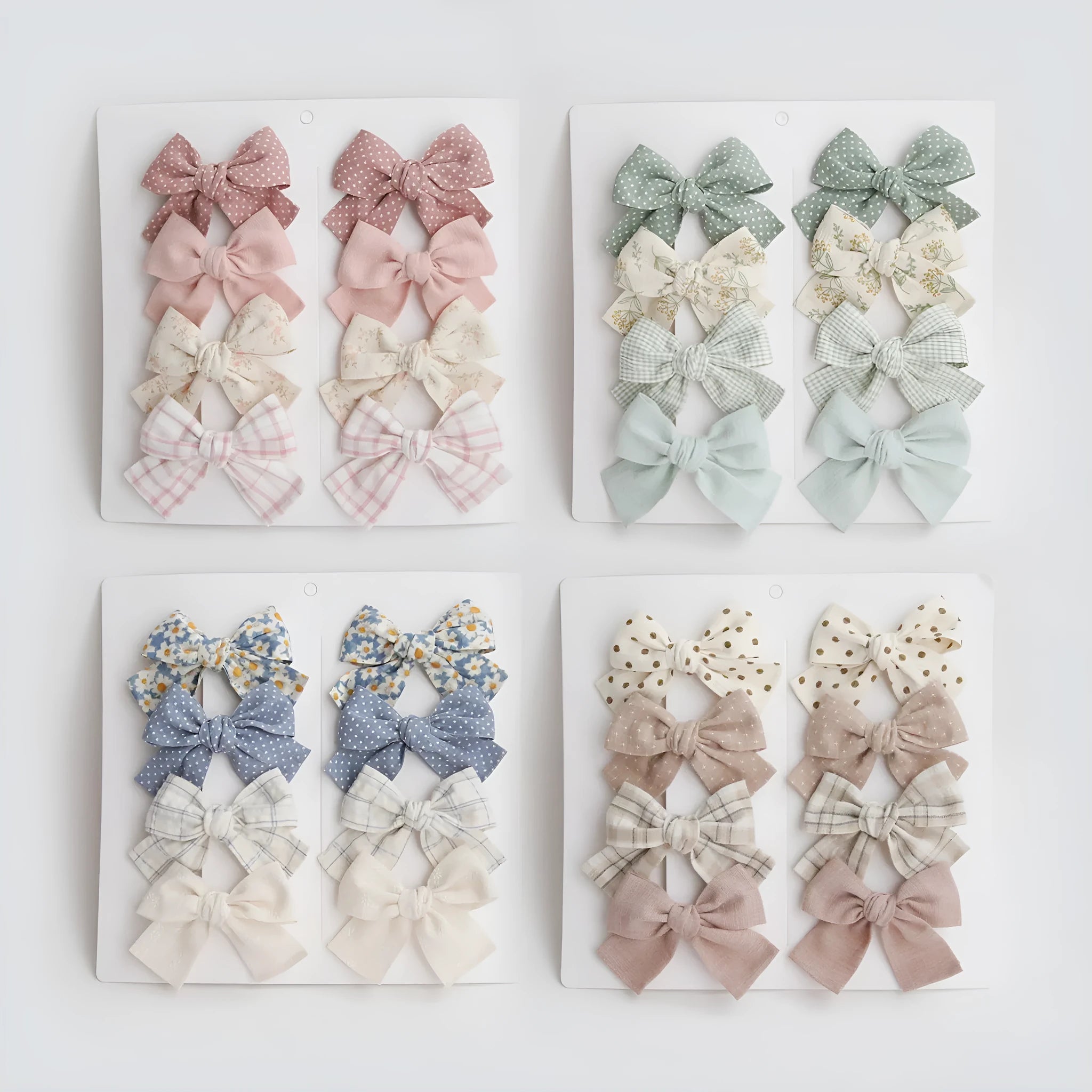Children's cloth dovetail bow hairclip set showing eight colour pattern options