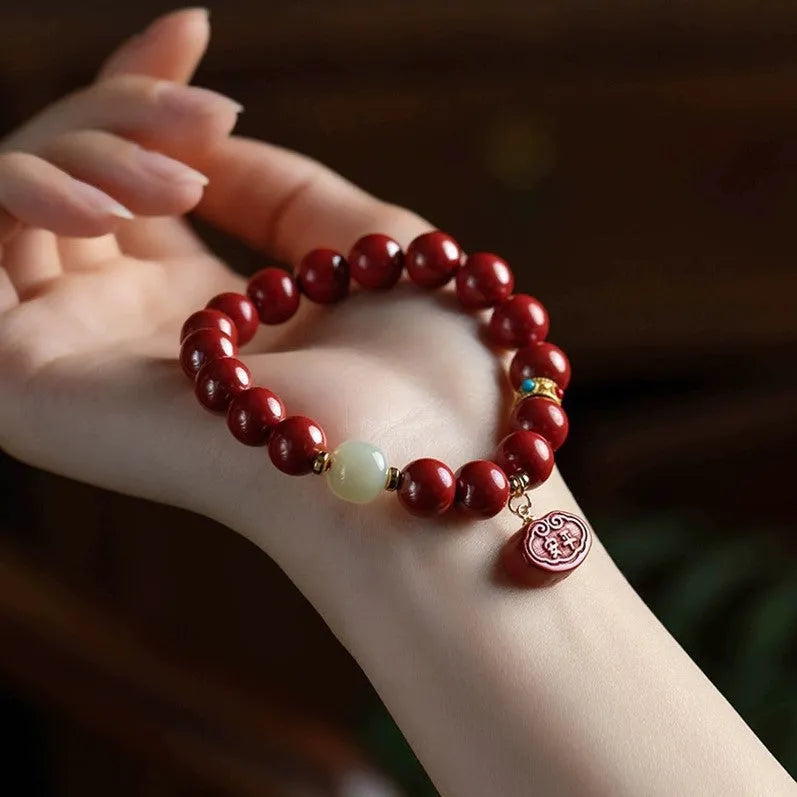 Red cinnabar bracelet with emperor sandstone carving featuring Ping An Fu Lu characters
