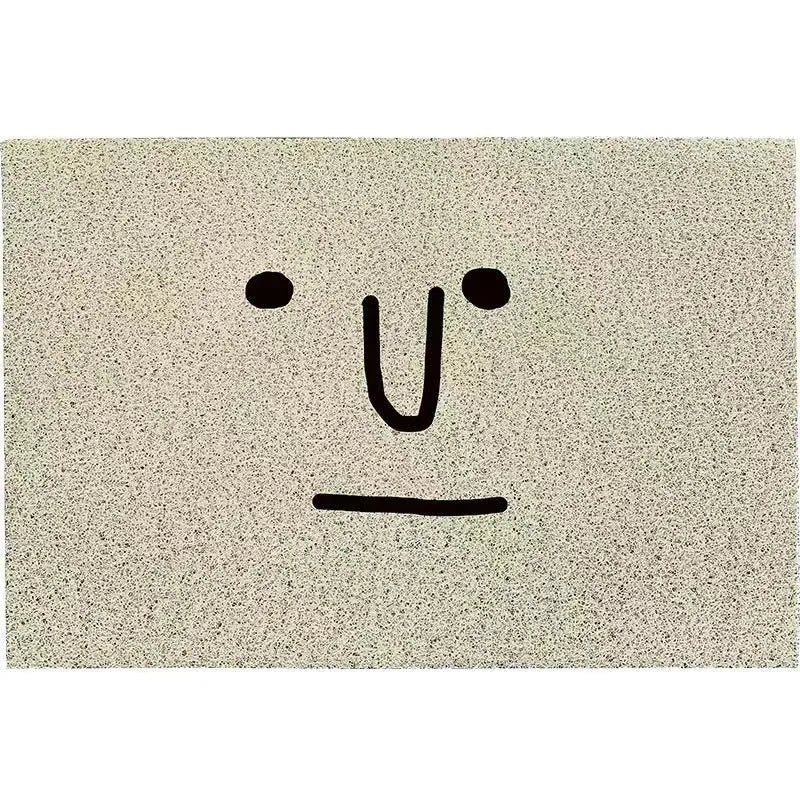 Square PVC floor mat with cartoon facial expression and geometric pattern in Mr Big Nose colour