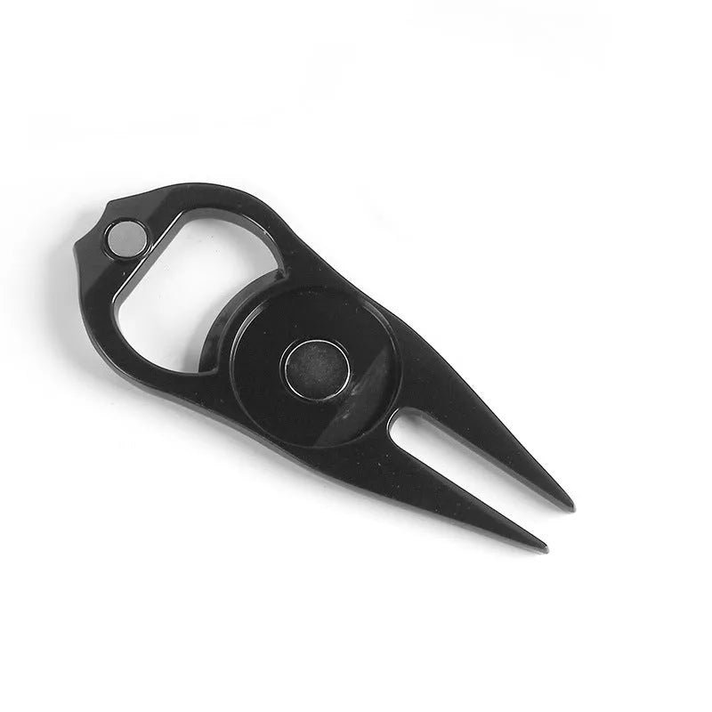 Zinc alloy golf tool with ball yoke and bottle opener, shown with a separate ball marker coin, in black, green, and silver colours.