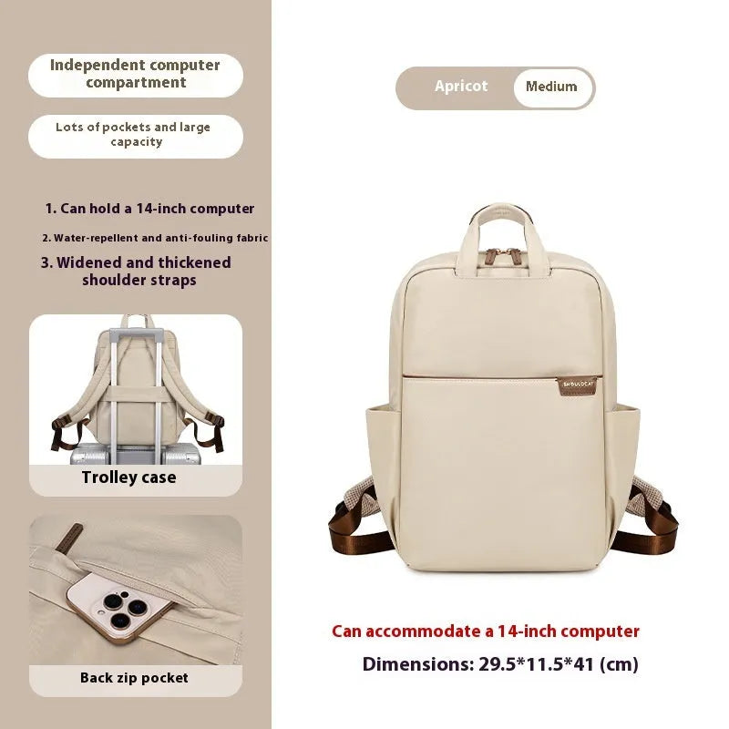 Large nylon women's travel backpack in apricot colour showing internal laptop compartment and multiple pockets.