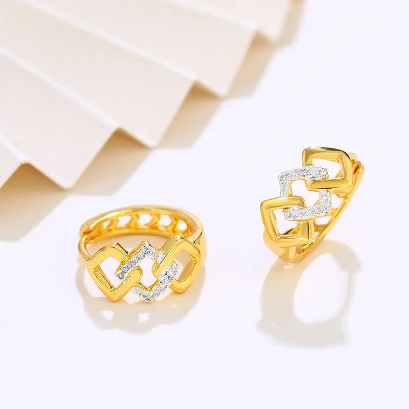 Gold geometric hollow-out alloy earrings for women on a plain background.