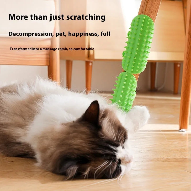 Silicone cat grooming massage comb with adjustable strap mounted on a table leg.