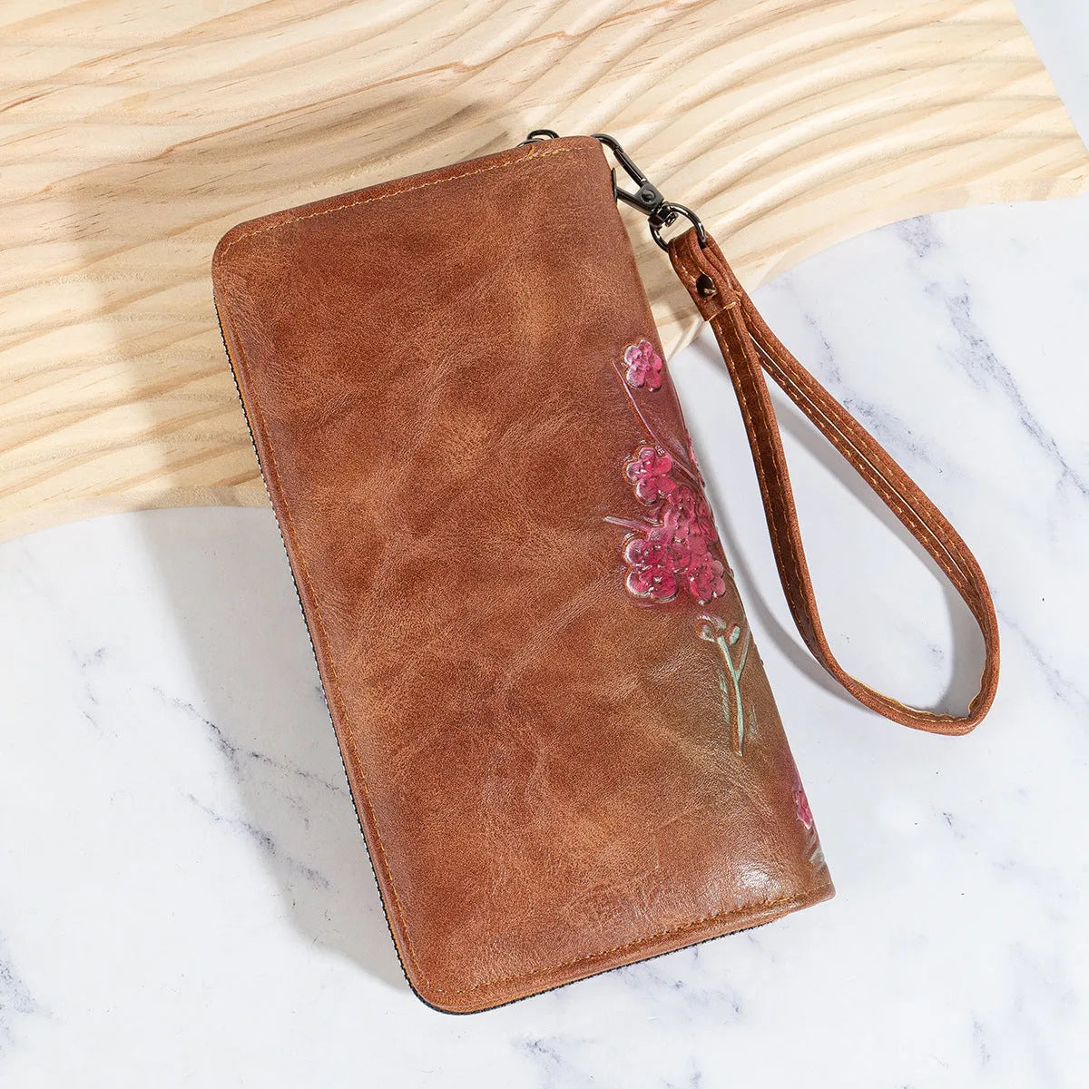 Chinese style embossed floral pattern handbag with hand-painted details in black, brown, and coffee colours