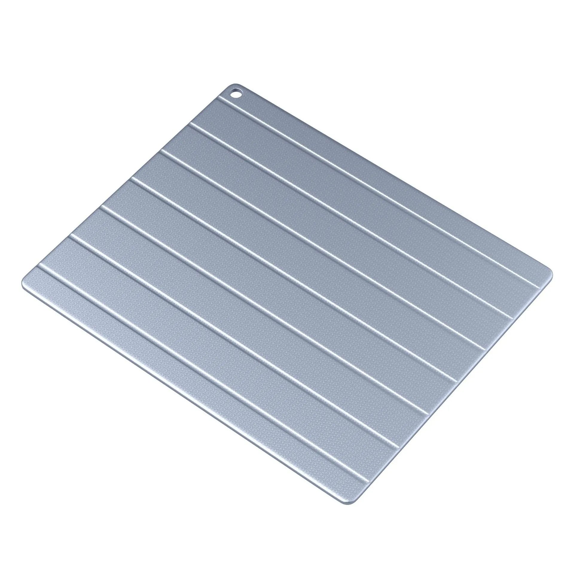 Aluminium quick defrosting plate food defrosting device with USB cable on a kitchen counter