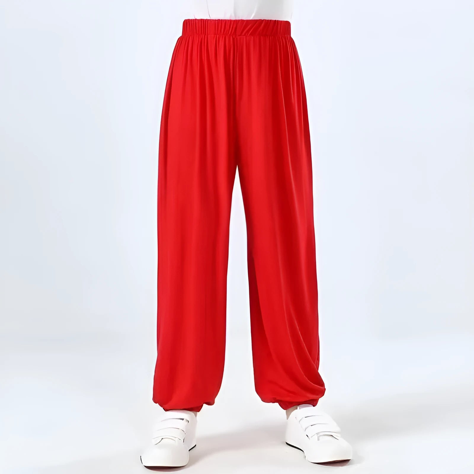 Black children's high-elasticity Sanda practice pants made from Lycra fabric, laid flat.