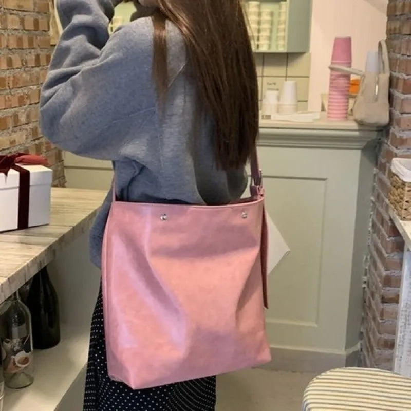 Pink corduroy one-shoulder bag with a single strap, shown with dimensions.