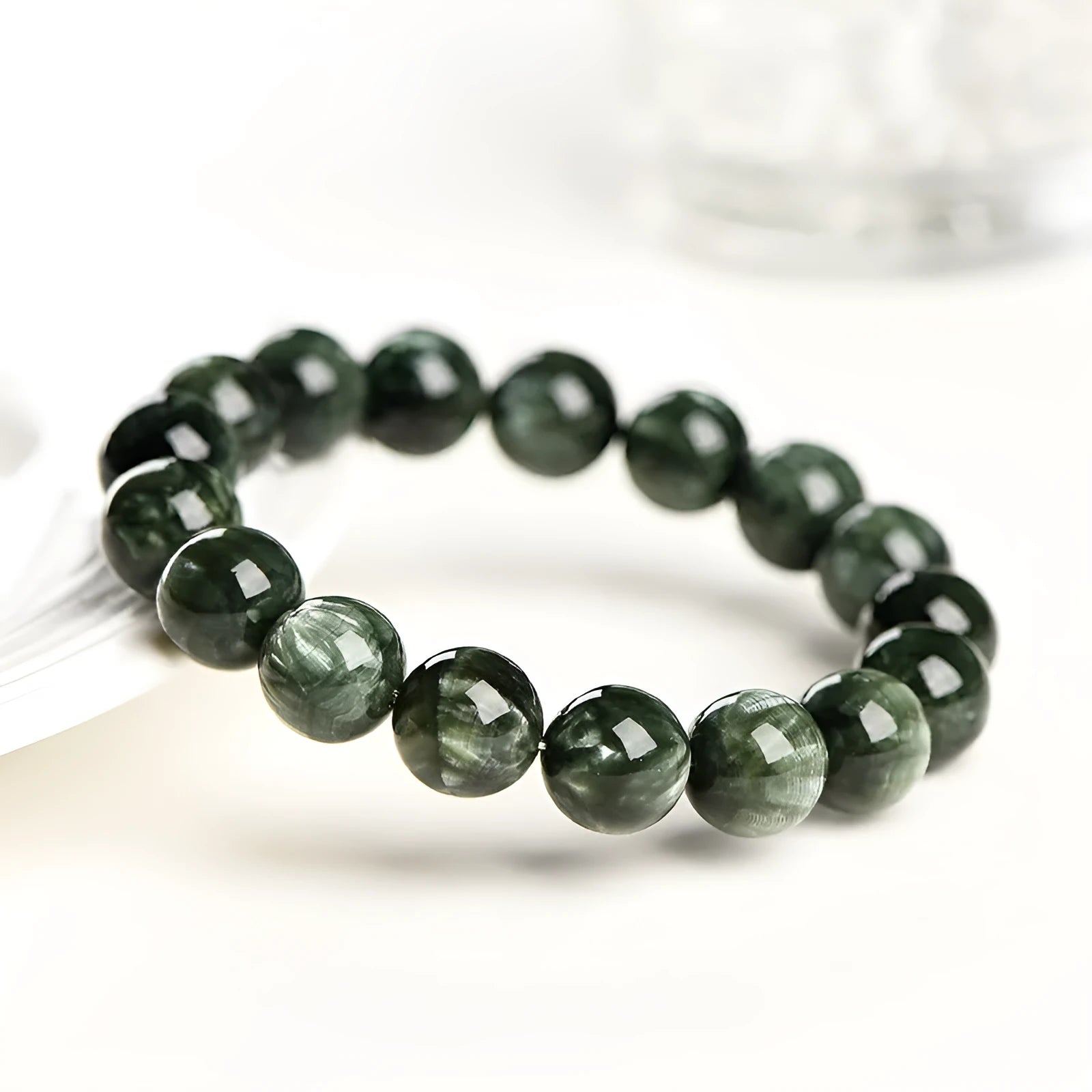 Green Dragon Crystal bracelet with round beads and a ruyi decorative motif.