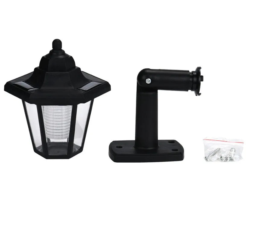 Black hexagonal solar-powered wall lamp with light sensor for outdoor use