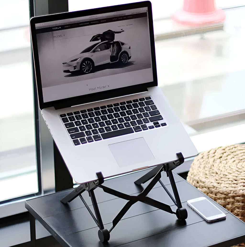 Black reinforced nylon folding laptop stand shown in a folded position with dimensions.