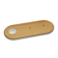 Bamboo wireless charging pad with beech wood trim on a desk