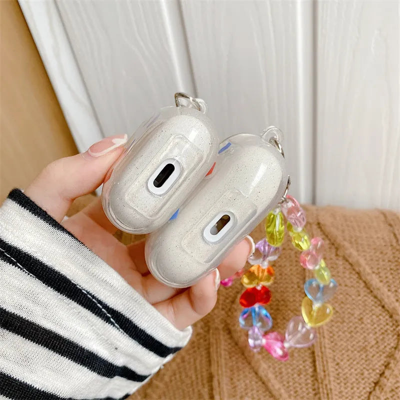 Solid colour TPU flip-style protective case for Apple AirPods with attached chain in colour love chain design.