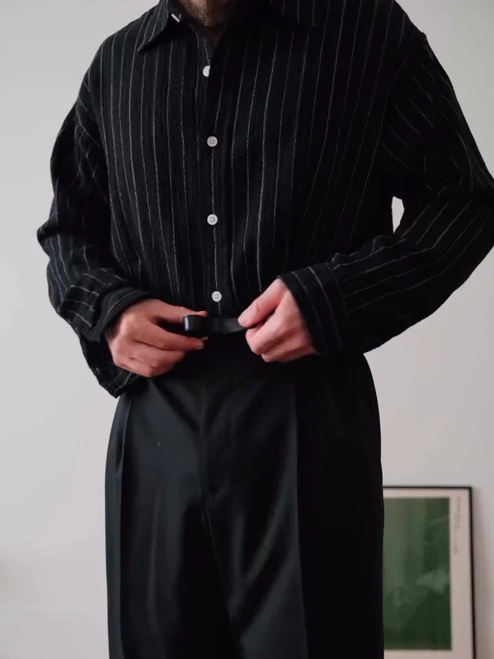 Black pinstriped button-down shirt with regular fit on a model.