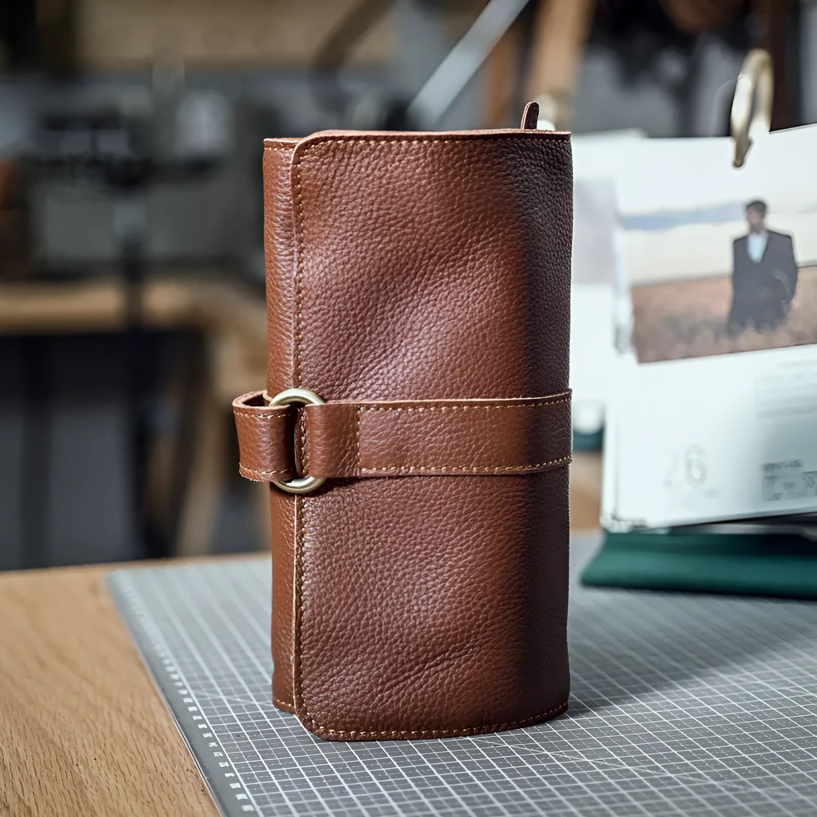 Handmade dark brown leather wallet with tape extraction closure showing 20cm width
