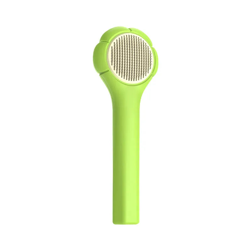 Floating needle comb for cats and dogs in green colour with ABS handle and steel teeth