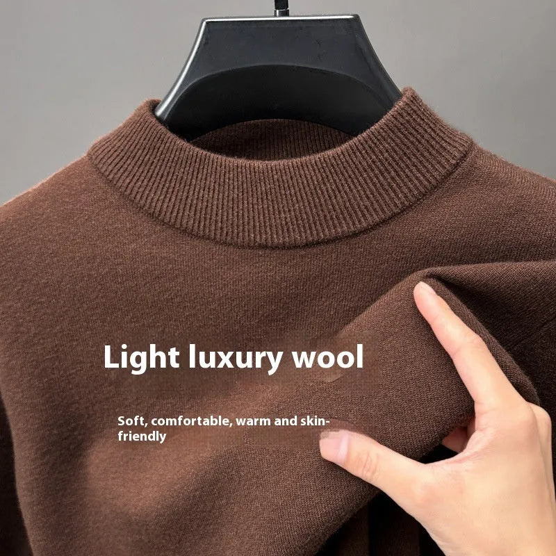 Men's fine yarn wool half turtleneck pullover sweater in a solid colour on a hanger.
