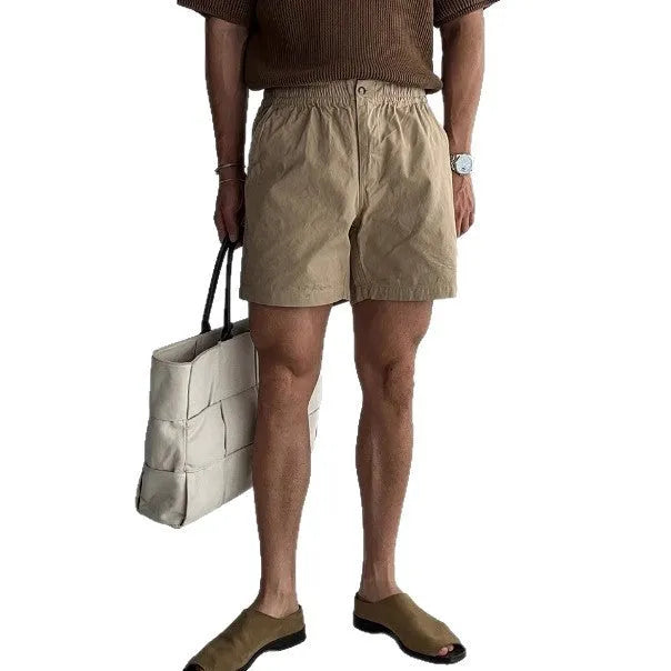 Loose-fit cotton sports shorts in black colour shown on model