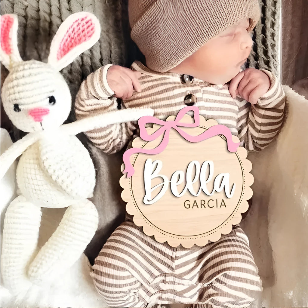 Square wooden baby room ornament personalised with a child's name in two available sizes.