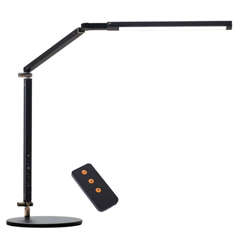 Black clip mount LED desk lamp with dimmer switch attached to study desk edge
