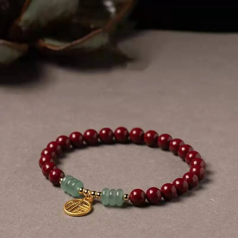 Handcrafted gold cinnabar bracelet with wave design in pumpkin cinnabar colour